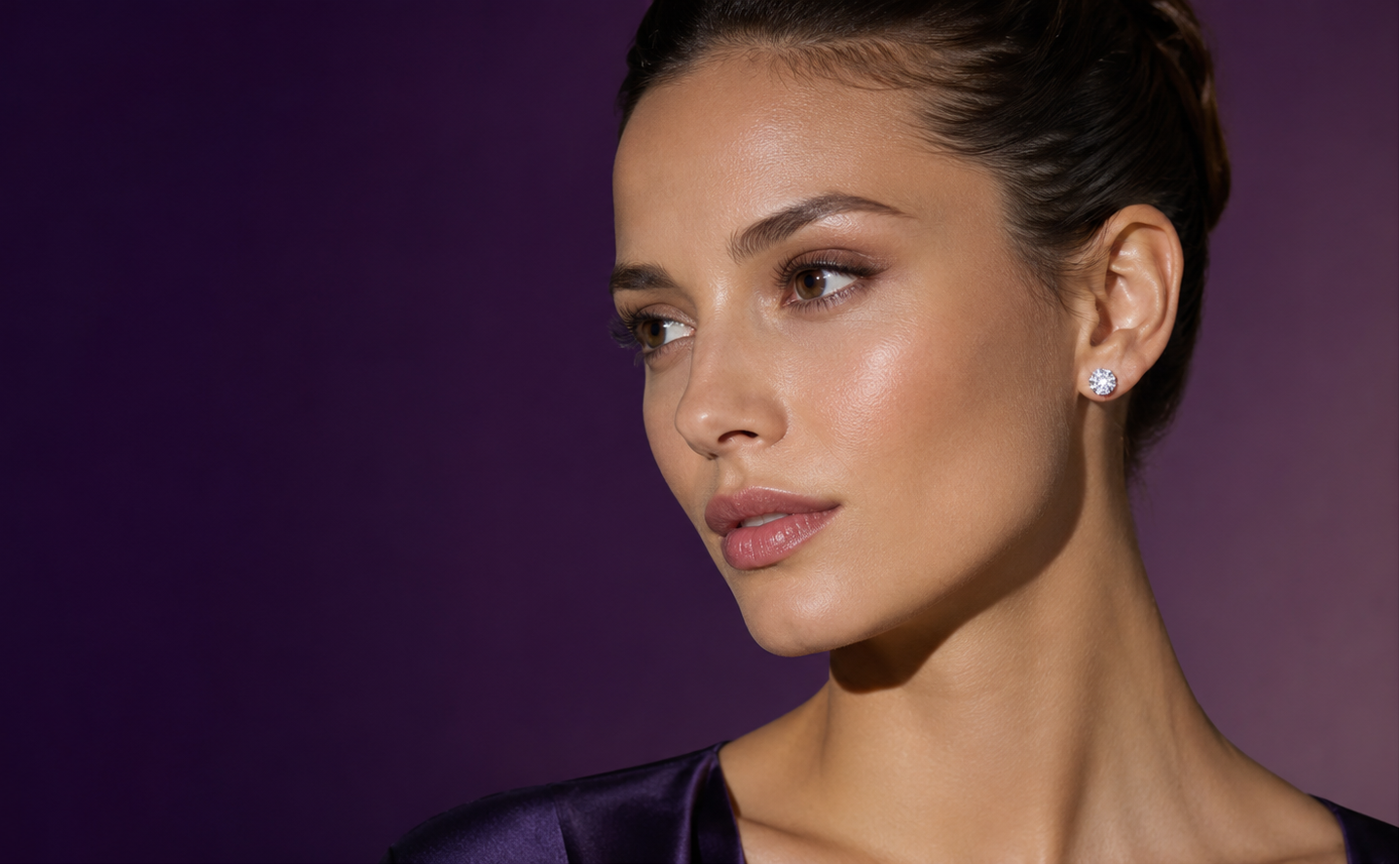Woman wearing a Diamond Stud against a purple background